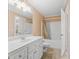 Bathroom featuring a white vanity, tile floors, and a shower-tub combination with a neutral-toned curtain at 2101 Heavens Way, Summerville, SC 29483