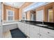 Bathroom with double sink vanity, granite countertop, and large mirror at 2101 Heavens Way, Summerville, SC 29483