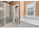 Bathroom featuring shower, garden tub, and bright window at 2101 Heavens Way, Summerville, SC 29483