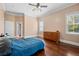 Bedroom with wood floors, large window, and closet space at 2101 Heavens Way, Summerville, SC 29483