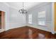 Elegant dining room with classic chandelier, wainscoting, and ample natural light at 2101 Heavens Way, Summerville, SC 29483