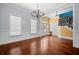 Inviting dining room with chandelier, wainscoting, and large windows for bright, natural light at 2101 Heavens Way, Summerville, SC 29483