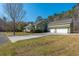Spacious home with a three-car garage, well-manicured lawn, and paved driveway, offering ample parking at 2101 Heavens Way, Summerville, SC 29483