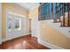 Elegant foyer featuring hardwood floors, a wooden staircase, and a view of the front door with sidelights at 2101 Heavens Way, Summerville, SC 29483