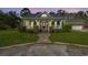 Charming home with a covered front porch, manicured lawn, and inviting entrance with stairs at 2101 Heavens Way, Summerville, SC 29483