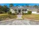 Charming home with a covered front porch, manicured lawn, and inviting entrance with stairs at 2101 Heavens Way, Summerville, SC 29483