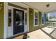 Inviting front porch with a stylish black door, sidelights, and detailed trim, offering curb appeal at 2101 Heavens Way, Summerville, SC 29483