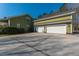 Spacious three-car garage connected to the main house with a paved driveway and tidy landscaping at 2101 Heavens Way, Summerville, SC 29483