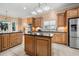 Modern kitchen with stainless steel refrigerator, kitchen island, and eat-in breakfast nook at 2101 Heavens Way, Summerville, SC 29483