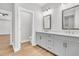 Bathroom featuring double vanity with framed mirrors and quartz countertops at 2210 Norwood Oaks Dr, Mount Pleasant, SC 29466