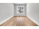 Bedroom with light wood flooring and large window overlooking neighborhood at 2210 Norwood Oaks Dr, Mount Pleasant, SC 29466