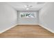 Empty bedroom with light hardwood floors and large windows offering ample natural light at 2210 Norwood Oaks Dr, Mount Pleasant, SC 29466