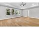 Spacious bedroom with hard wood floors, a ceiling fan, and a view to the backyard at 2210 Norwood Oaks Dr, Mount Pleasant, SC 29466