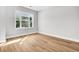 Bedroom with light wood flooring and large window at 2210 Norwood Oaks Dr, Mount Pleasant, SC 29466