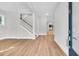 Open-concept foyer with hardwood floors, staircase, and views into other rooms at 2210 Norwood Oaks Dr, Mount Pleasant, SC 29466