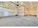 Spacious unfinished two-car garage with exposed ceiling and concrete floor, ready for customization at 2210 Norwood Oaks Dr, Mount Pleasant, SC 29466