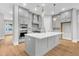Modern kitchen with gray cabinetry, stainless steel appliances, and an expansive island with pendant lighting at 2210 Norwood Oaks Dr, Mount Pleasant, SC 29466