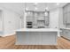 Spacious kitchen featuring a large island, stainless steel appliances, and stylish gray cabinetry at 2210 Norwood Oaks Dr, Mount Pleasant, SC 29466