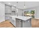 Gray kitchen with an oversized kitchen island, modern appliances, and a farm style sink at 2210 Norwood Oaks Dr, Mount Pleasant, SC 29466