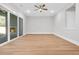 Spacious living room with sliding glass doors leading to an outdoor fireplace at 2210 Norwood Oaks Dr, Mount Pleasant, SC 29466