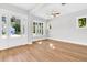 Bright and airy living room with beautiful hardwood floors, recessed lighting, and multiple windows at 2210 Norwood Oaks Dr, Mount Pleasant, SC 29466
