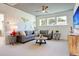 Comfortable living room featuring a gray sectional, carpet, and stylish decor at 2210 Norwood Oaks Dr, Mount Pleasant, SC 29466