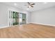 Bright living room with sliding glass doors leading to an outdoor fireplace and backyard at 2210 Norwood Oaks Dr, Mount Pleasant, SC 29466