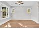 Neutral colored living room with lots of windows and natural light and a ceiling fan at 2210 Norwood Oaks Dr, Mount Pleasant, SC 29466