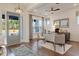Stylish home office with shiplap wall, modern desk, dark wood floors, and lots of natural light at 2210 Norwood Oaks Dr, Mount Pleasant, SC 29466