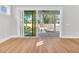 View from the living room features sliding glass doors, hardwood floors, and natural light at 2210 Norwood Oaks Dr, Mount Pleasant, SC 29466