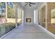 Inviting screened-in porch with an outdoor fireplace and ample space for relaxing at 2210 Norwood Oaks Dr, Mount Pleasant, SC 29466