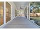 Spacious screened-in porch with a ceiling fan and views of the backyard at 2210 Norwood Oaks Dr, Mount Pleasant, SC 29466