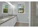 Double sink bathroom with natural light and granite countertops at 2212 Telfair Way, Charleston, SC 29412