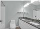 Bathroom featuring a granite vanity, shower-tub combo, toilet, and light fixtures at 2212 Telfair Way, Charleston, SC 29412