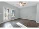 Bright bedroom features sliding glass door, a window, and wood-look floors at 2212 Telfair Way, Charleston, SC 29412