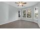Bright bedroom featuring hard wood floors, ceiling fan, and large windows at 2212 Telfair Way, Charleston, SC 29412