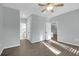 Bright bedroom features a ceiling fan and two entry ways with wood-look floors at 2212 Telfair Way, Charleston, SC 29412