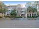 Well maintained condo building with manicured landscaping and assigned parking at 2212 Telfair Way, Charleston, SC 29412
