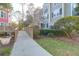Condo exterior with lush landscaping, a wooden bridge, and well-manicured lawns at 2212 Telfair Way, Charleston, SC 29412