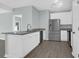 Modern kitchen featuring stainless steel appliances, white cabinets, and granite countertops at 2212 Telfair Way, Charleston, SC 29412