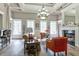 Bright and inviting living room with ample windows, a fireplace, and modern furniture at 2212 Telfair Way, Charleston, SC 29412