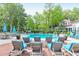 Inviting community pool area with lounge chairs and umbrellas, perfect for relaxing and enjoying the outdoors at 2212 Telfair Way, Charleston, SC 29412