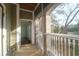 Open screened porch with ceiling fan, showcasing the outdoor scenery at 2212 Telfair Way, Charleston, SC 29412