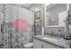 Pretty bathroom with a pink patterned shower curtain and gray walls at 242 Bering Ln, Summerville, SC 29486