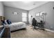 Neutral bedroom with a comfortable bed, sleek desk and ample natural light streaming in through the window at 242 Bering Ln, Summerville, SC 29486