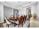 Formal dining room with natural light, wood table, and views of the kitchen and entry at 242 Bering Ln, Summerville, SC 29486