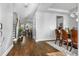 Inviting foyer with hardwood floors leading to a dining area and living space with a staircase and views of the backyard at 242 Bering Ln, Summerville, SC 29486