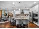 Open kitchen with granite countertops, stainless appliances, and a large island with barstool seating at 242 Bering Ln, Summerville, SC 29486
