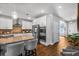 Open concept kitchen with island seating, stainless steel appliances, and ample cabinet space at 242 Bering Ln, Summerville, SC 29486