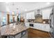 Spacious kitchen featuring granite countertops, stainless steel appliances, and ample natural light at 242 Bering Ln, Summerville, SC 29486